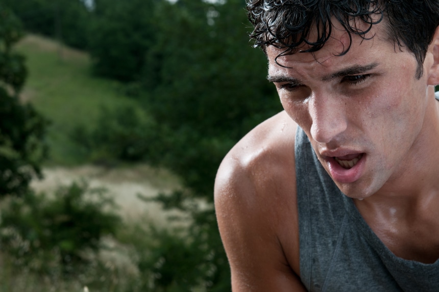 An exhausted runner who is sweating