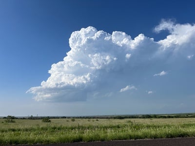 A small cumulonimbus cloud above a field in southwestern Oklahoma