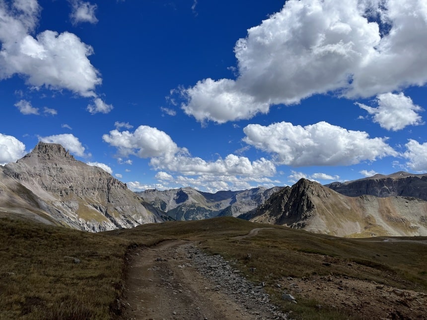 Cumulus clouds above the rugged peaks of Colorado’s San Juan mountains